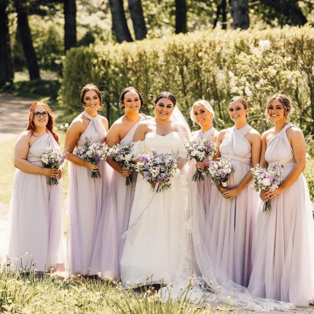 Whispers of lavender and the softest tulle twirling in the summer breeze.

Our multiway dress brings all the romantic vibes — made to move, made to shine, made for memories next to the beautiful bride.

A wedding day full of love and friendships 💜

Forever in bloom. #SoftRomance #TulleDreams #BridesmaidGoals #lavenderbridesmaid #lilacwedding #tullebridesmaiddresses #katesdresses